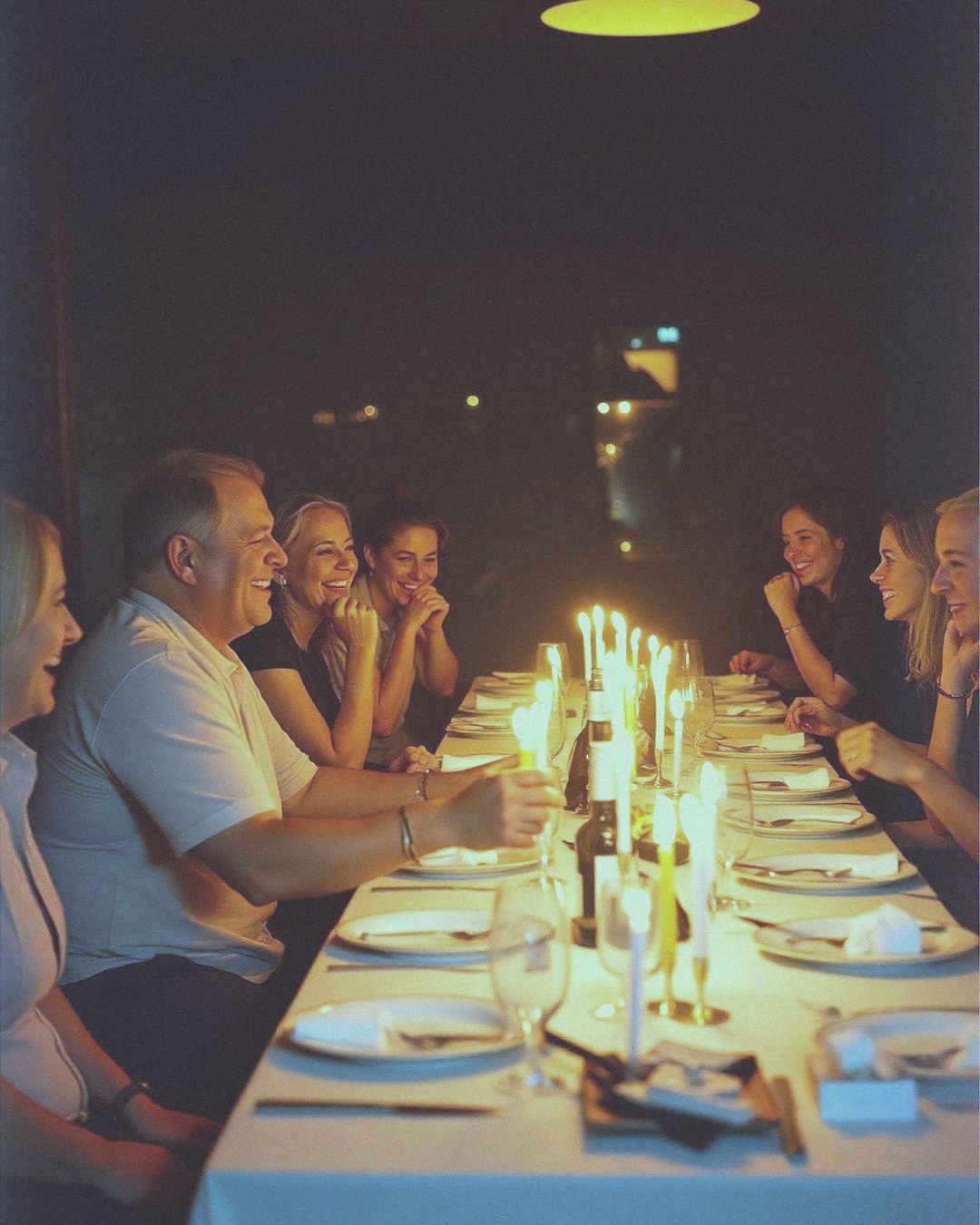 Friends around a cake full of candles